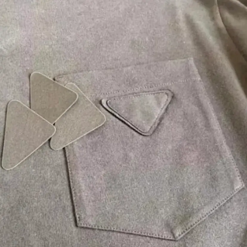 PRA 24SS Ripped-Triangle 三角標貼布 水洗 簡約素色 短袖T恤
